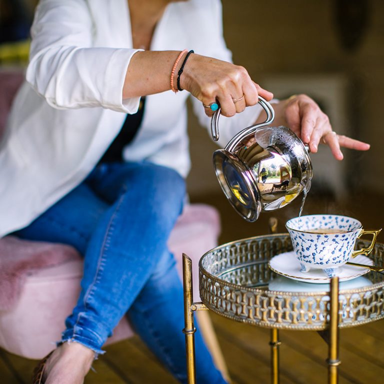 The Meraki Cabin - Maria self portrait - pouring tea - retreats - Iggy & Lime